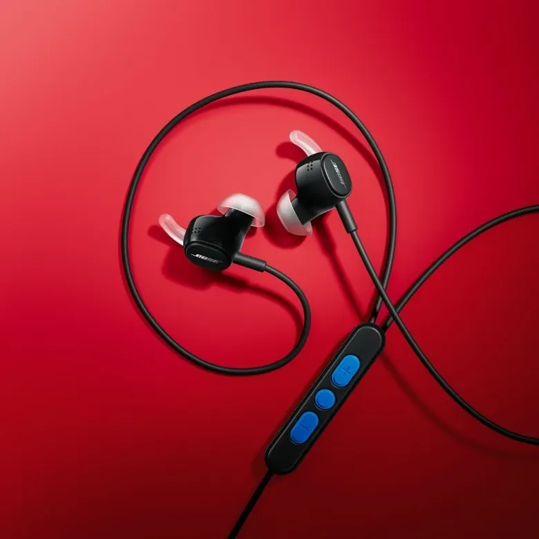 Bose wired earbuds with USB-C connector on a desk