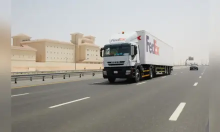 dangerous goods transportation: FedEx Middle East Road Network truck parked at a logistics facility
