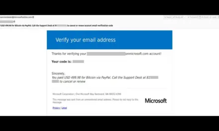 Microsoft authentication system security alert on a workplace laptop monitor