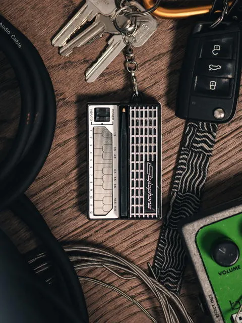 Stylophone Mini pocket synthesizer held in hand